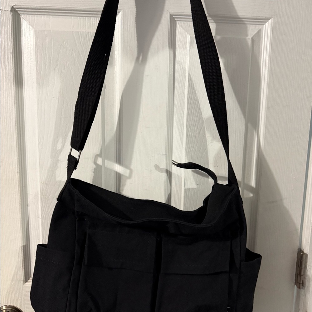 Black Messenger Bag with Fabric Texture and Adjustable Strap